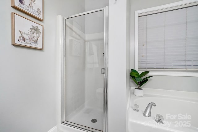 bathroom with shower with separate bathtub