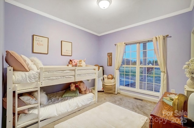 bedroom featuring ornamental molding and light colored carpet