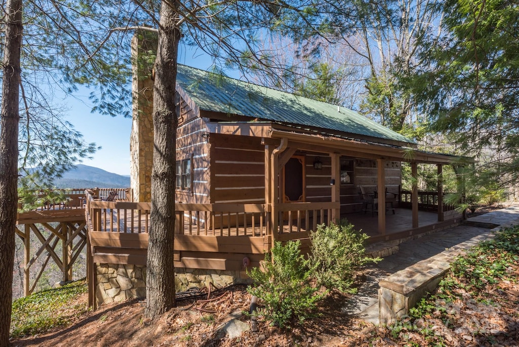 exterior space featuring a deck with mountain view