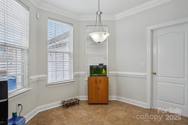 dining space with light tile patterned floors, baseboards, and ornamental molding