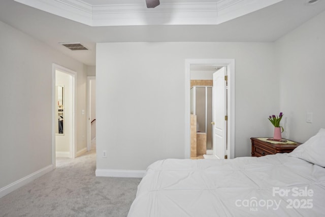 carpeted bedroom featuring visible vents, ensuite bathroom, baseboards, and ornamental molding