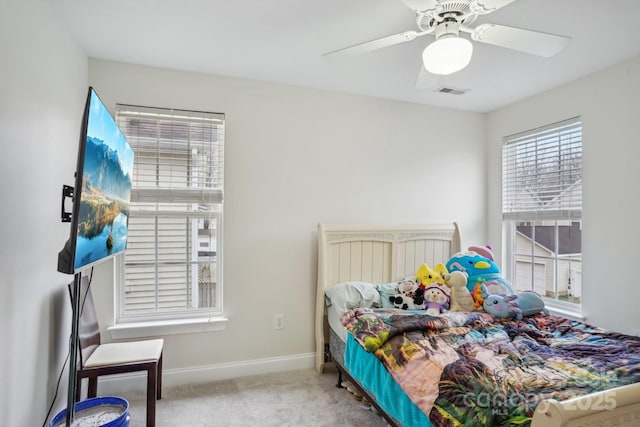 bedroom with visible vents, baseboards, carpet, and ceiling fan