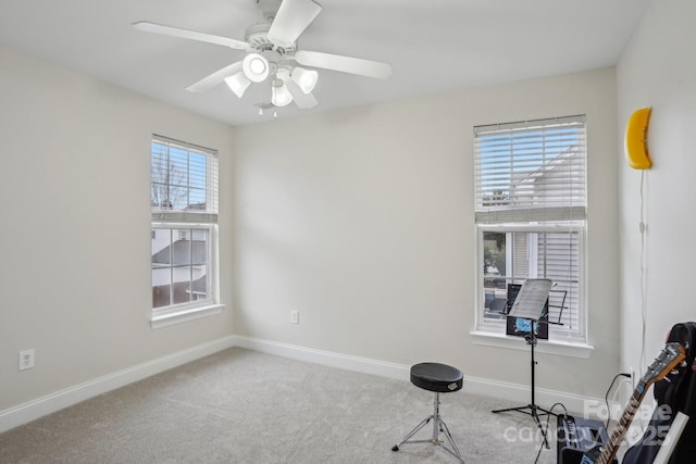 misc room with ceiling fan, baseboards, and carpet