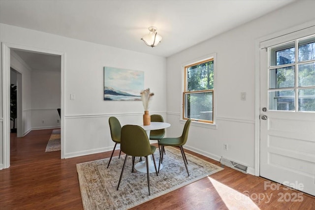 dining area featuring dark hardwood / wood-style floors