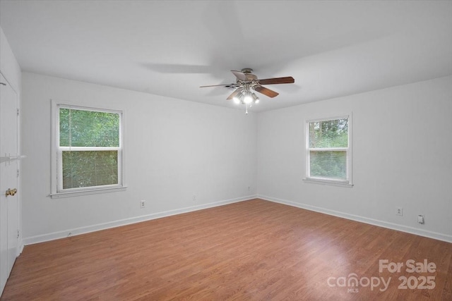 spare room featuring ceiling fan and light hardwood / wood-style flooring