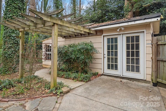 entrance to property featuring a pergola and a patio area