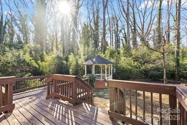 wooden deck featuring a gazebo