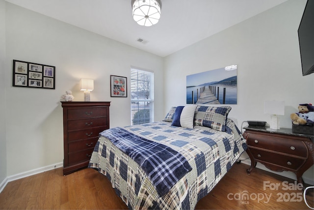 bedroom featuring dark hardwood / wood-style floors