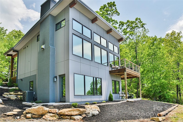 view of property exterior with central AC unit