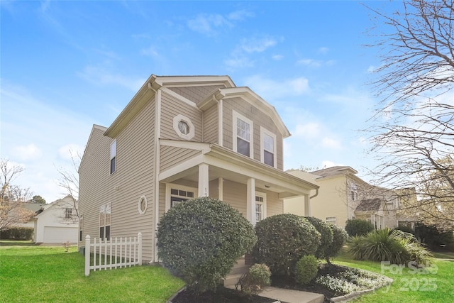 view of front facade featuring a garage and a front yard