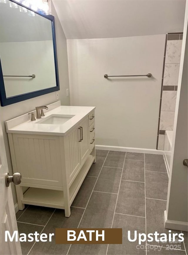 bathroom featuring tile patterned flooring and vanity