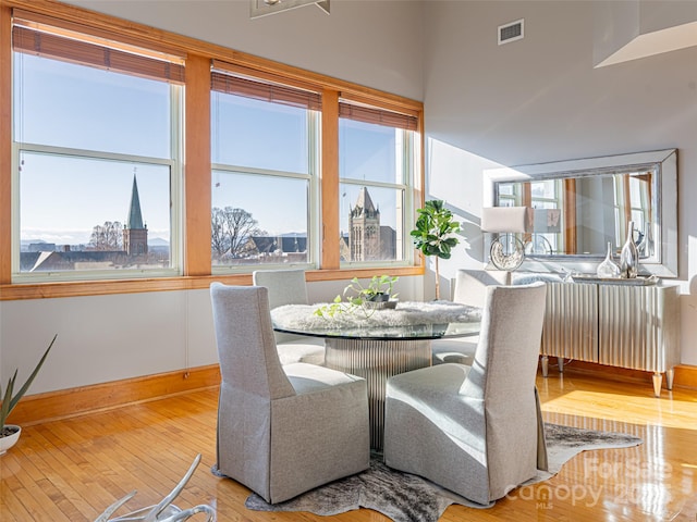 dining space with hardwood / wood-style floors