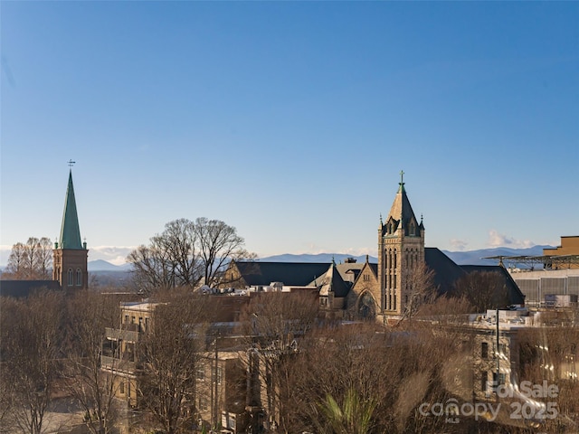 property's view of city with a mountain view