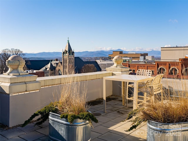 view of patio / terrace featuring a mountain view