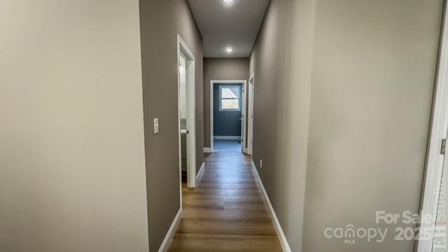 corridor with dark wood-type flooring