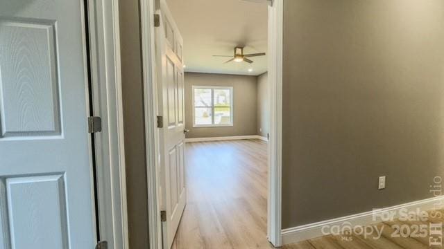 hall with light wood-type flooring