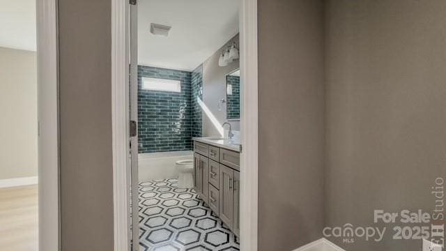 bathroom featuring vanity and toilet