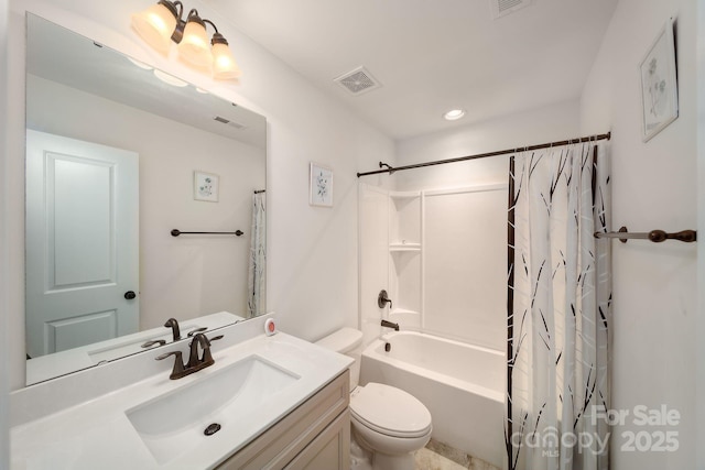 full bathroom with vanity, shower / bath combo, and toilet