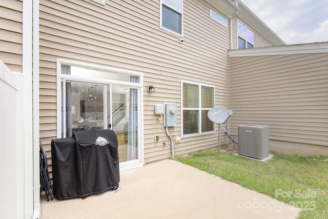 view of patio with central AC and area for grilling