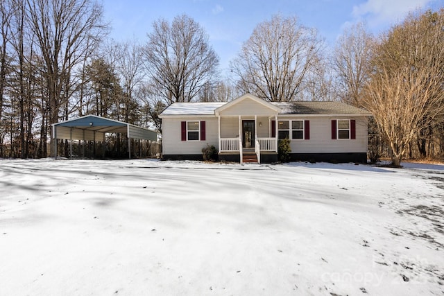 ranch-style house featuring a carport and covered porch