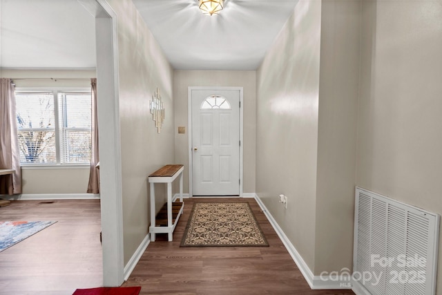 doorway to outside featuring hardwood / wood-style flooring