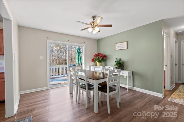 dining area with ceiling fan and hardwood / wood-style floors