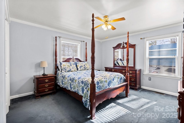 bedroom with ceiling fan, multiple windows, dark carpet, and crown molding