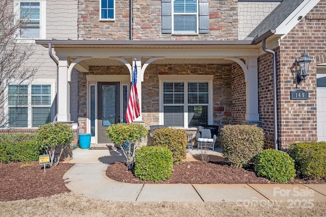 entrance to property featuring a porch