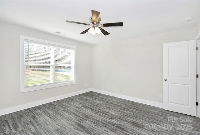 unfurnished room featuring dark hardwood / wood-style flooring and ceiling fan