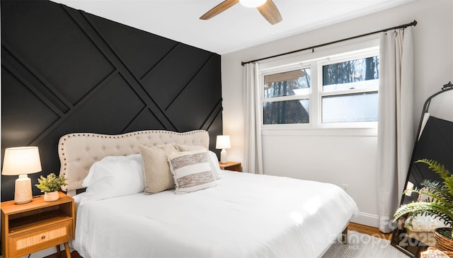 bedroom featuring hardwood / wood-style flooring and ceiling fan