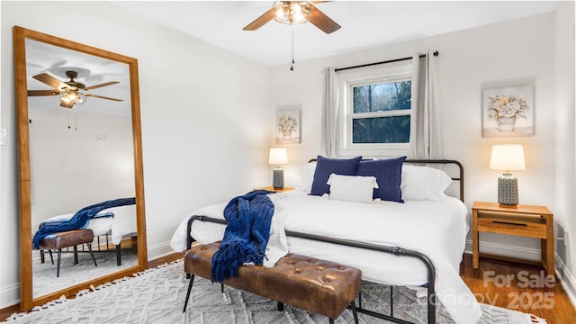 bedroom featuring hardwood / wood-style flooring and ceiling fan