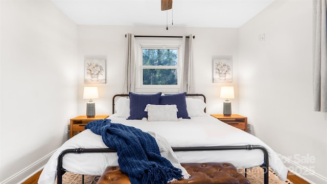 bedroom with wood-type flooring and ceiling fan