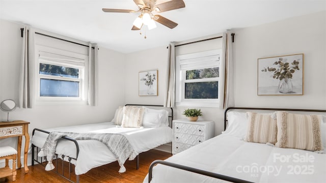 bedroom featuring ceiling fan and wood-type flooring