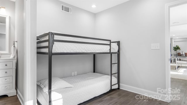 bedroom featuring dark hardwood / wood-style flooring