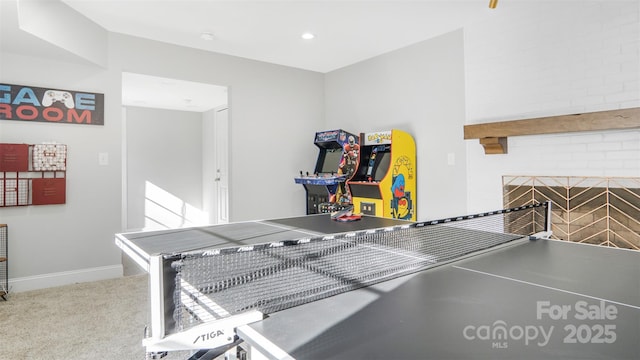 playroom with light carpet and a fireplace