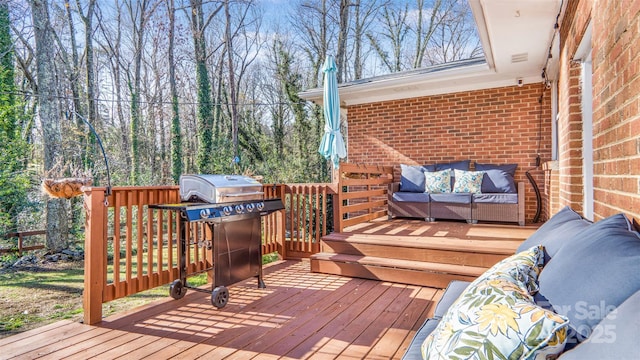 wooden terrace with an outdoor living space and a grill