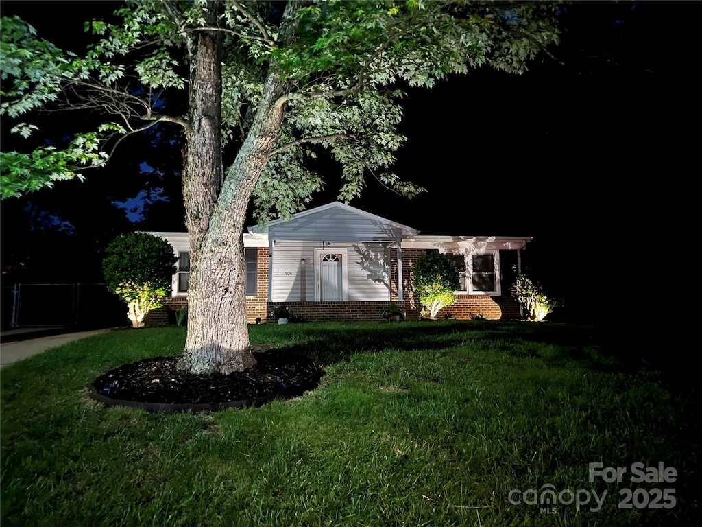 view of home's exterior featuring a yard