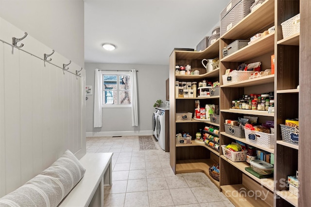 pantry featuring independent washer and dryer