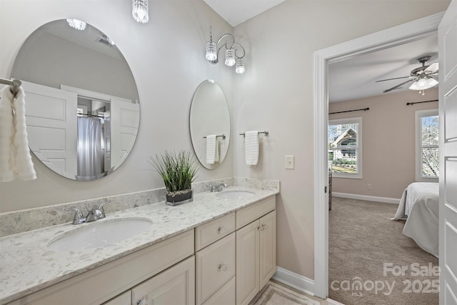 bathroom featuring ceiling fan and vanity