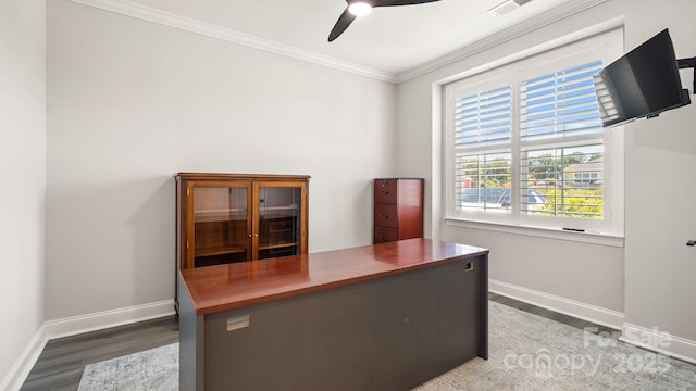 home office featuring dark wood-type flooring, ceiling fan, and ornamental molding