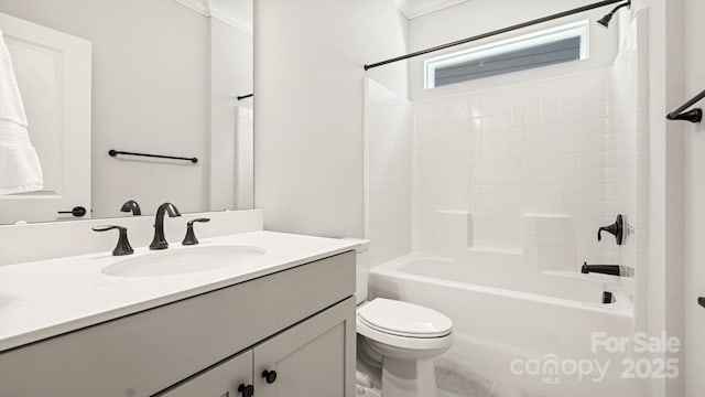 full bathroom featuring toilet, vanity, bathing tub / shower combination, and ornamental molding