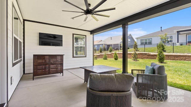 view of patio featuring ceiling fan