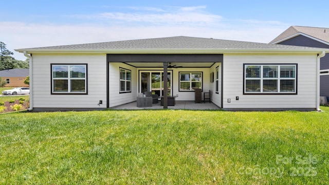 rear view of property with an outdoor hangout area, a patio, ceiling fan, central AC unit, and a yard