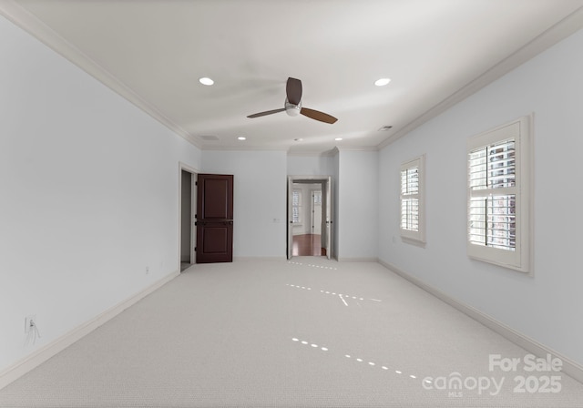 unfurnished bedroom with ornamental molding and light carpet