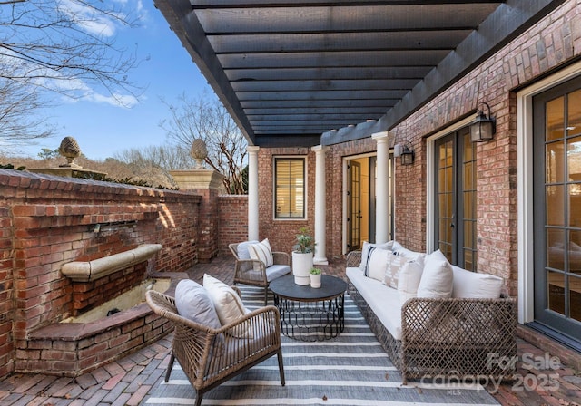 view of patio / terrace featuring an outdoor hangout area and a pergola