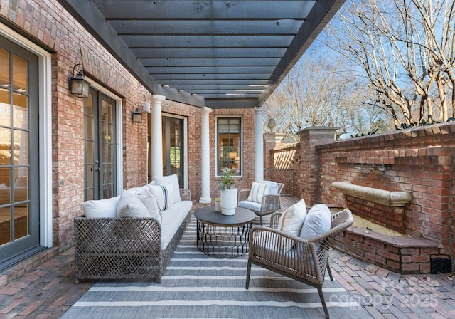 view of patio featuring an outdoor hangout area and a pergola