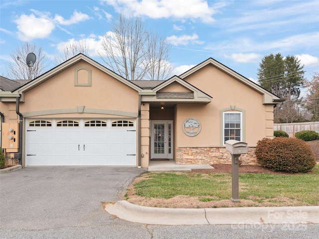 ranch-style house featuring a garage