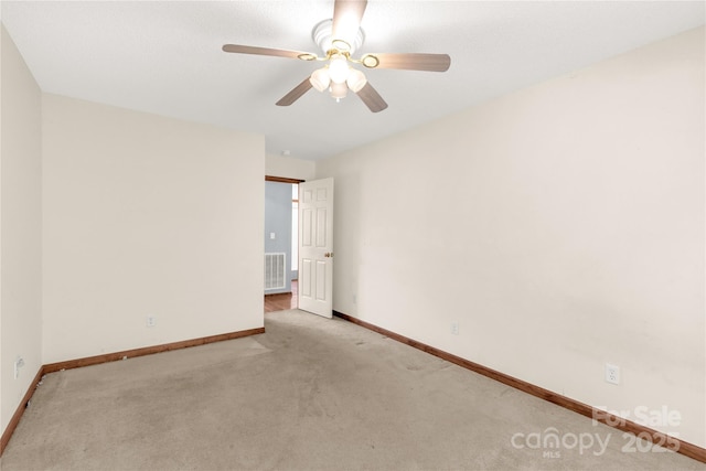 carpeted empty room with ceiling fan