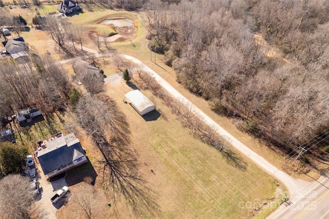 birds eye view of property with a rural view