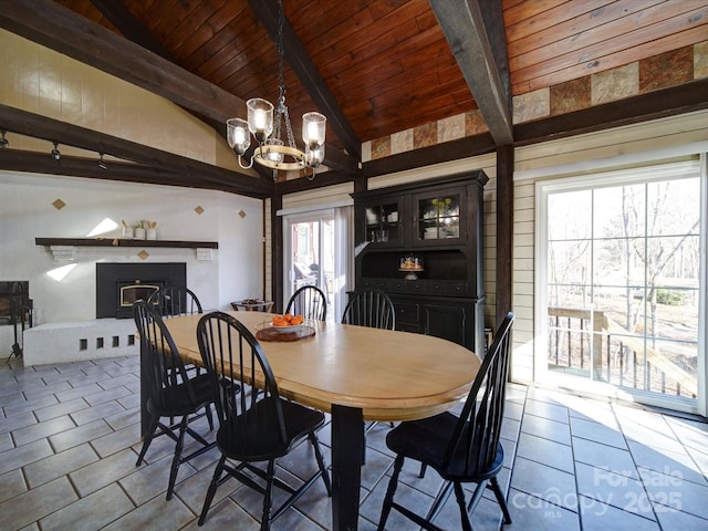 tiled dining area featuring vaulted ceiling with beams, wood ceiling, and a notable chandelier